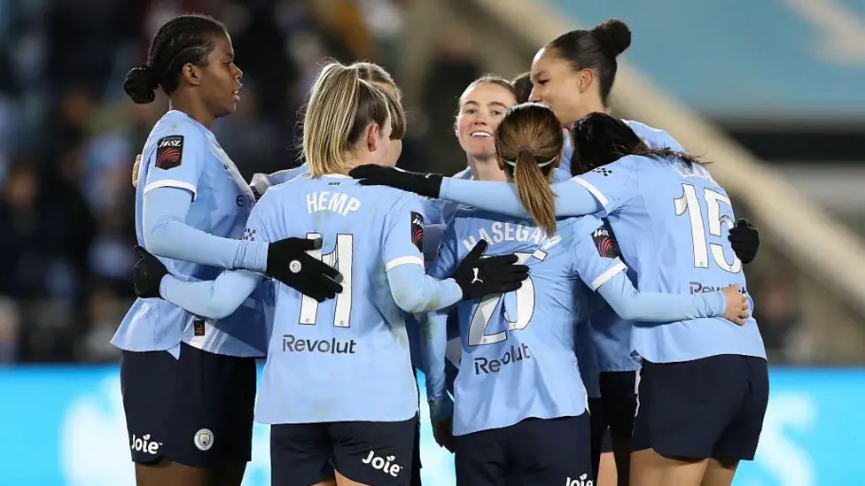 Man City players celebrate beating Leicester in the WSL