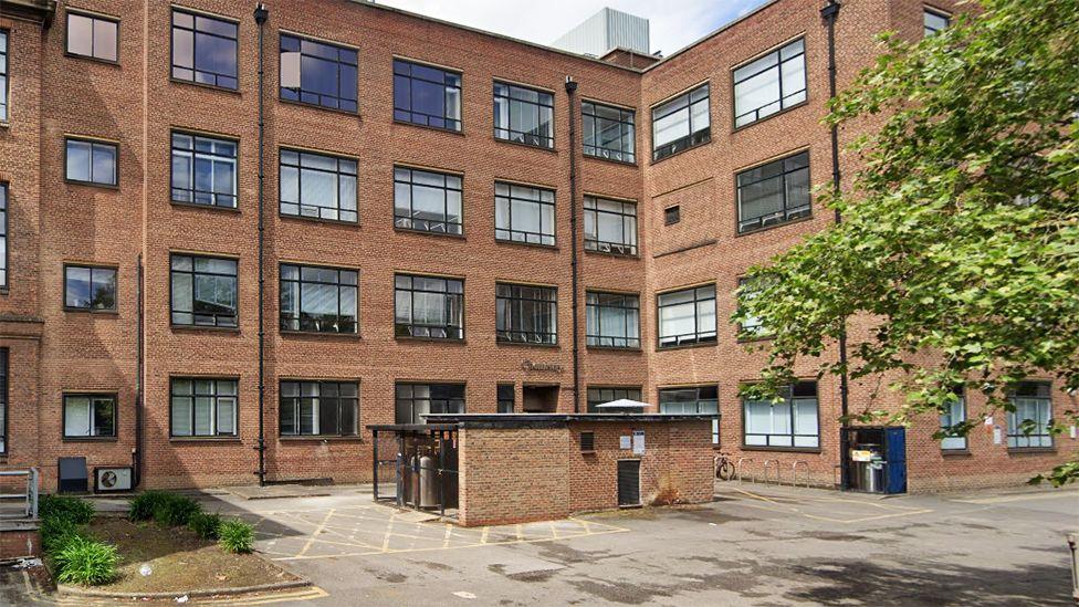 The exterior of the red brick, four-storey Chemistry building on the university campus.