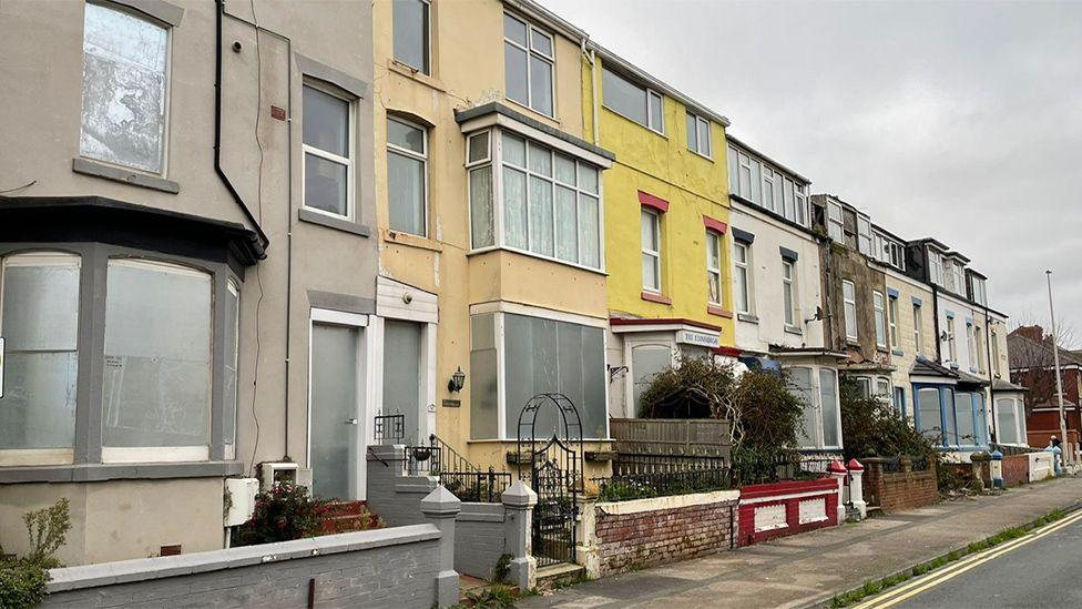 Street view of boarded up terraced houses in Charles Street, Blackpool