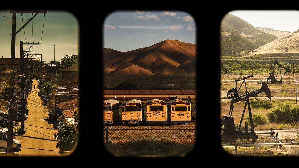 A triptych of images taken from a train window. Left to right: An alley in Chicago, school buses in front of mountains and a beam pump extracting oil from an inland well.