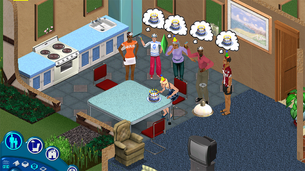 A screenshot from The Sims shows six characters in a kitchen setting, viewed from an isometric, top-down perspective. All of them are wearing party hats, and one sits at a table in front of a large cake with lit candles on top. The other characters stand in a line behind them, with birthday cake thought bubbles above their heads.