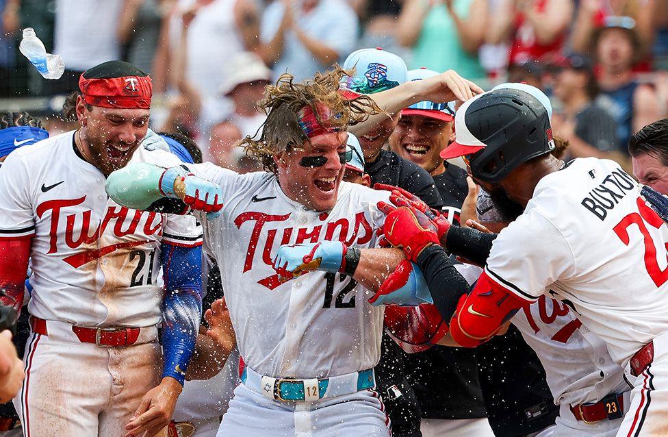 The Minnesota Twins celebrate after Harrison Bader hit a walk-off home run in the ninth inning of a game against the Tampa Bay Rays in Minneapolis. Photo by Ellen Schmidt