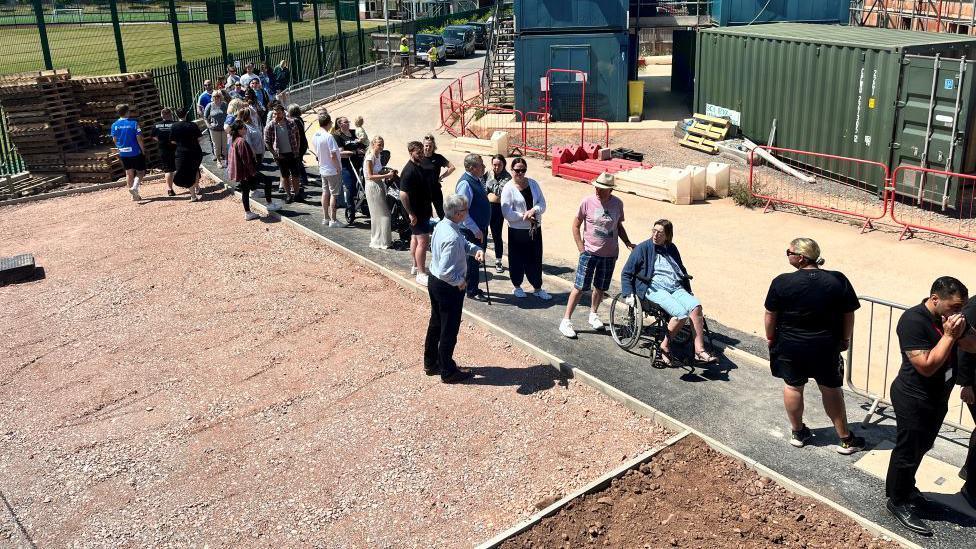 The queue of people outside the show home