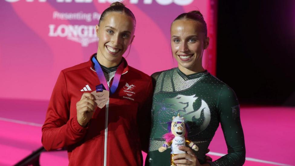 Identical twins win gymnastics medals on same day