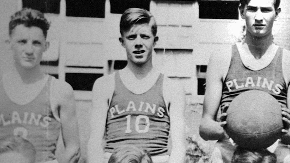 A teenaged Jimmy Carter (#10) is included in this group portrait of the Plains High School basketball team. Plains, Georgia, ca. 1940.