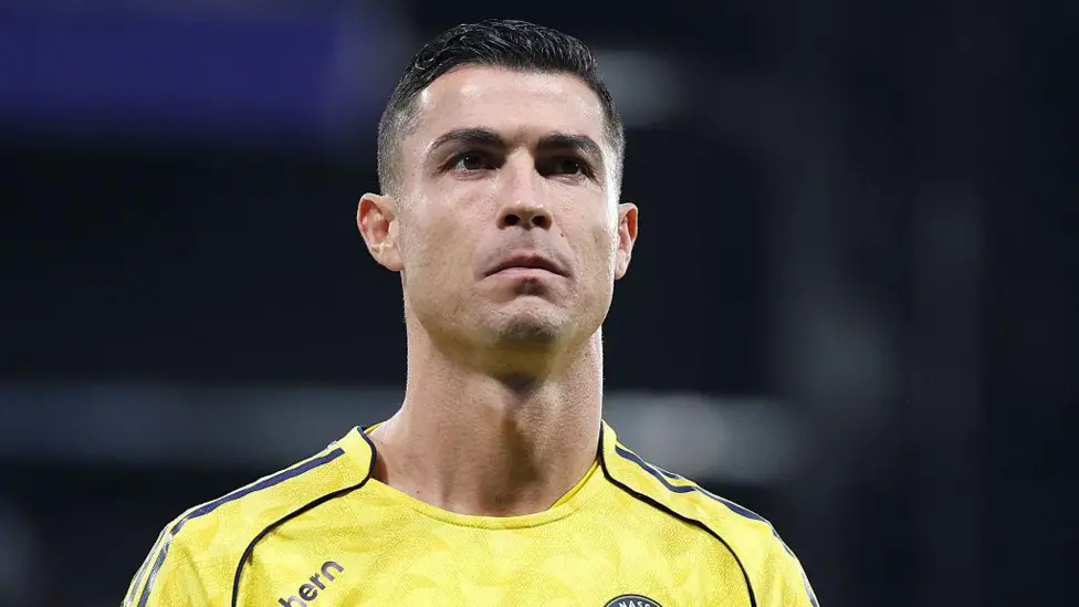 Head-and-shoulders image of Cristiano Ronaldo in a yellow Al-Nassr shirt