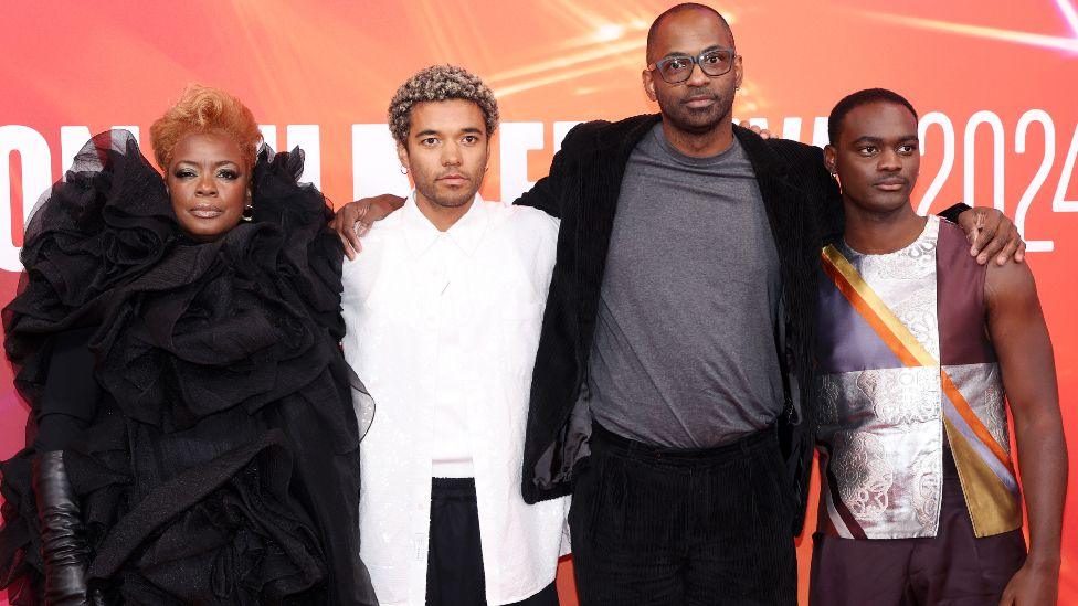 Aunjanue Ellis-Taylor, Brandon Wilson, RaMell Ross and Ethan Herisse all pose together with their arms around each other on the red carpet at the London Film Festival