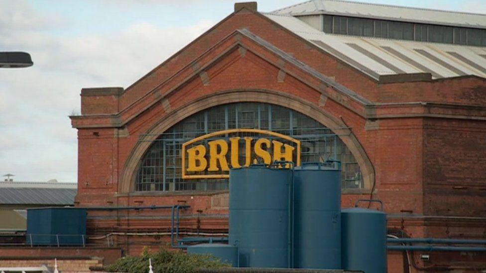 Brush building with iconic yellow sign