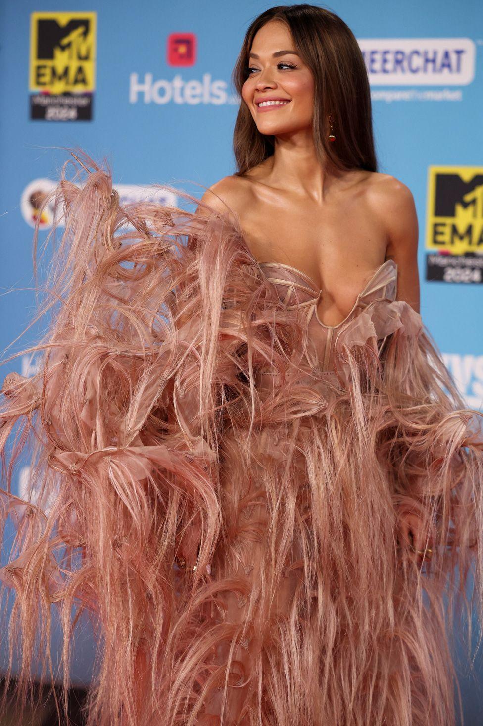 Rita Ora in an elaborate feathered dress