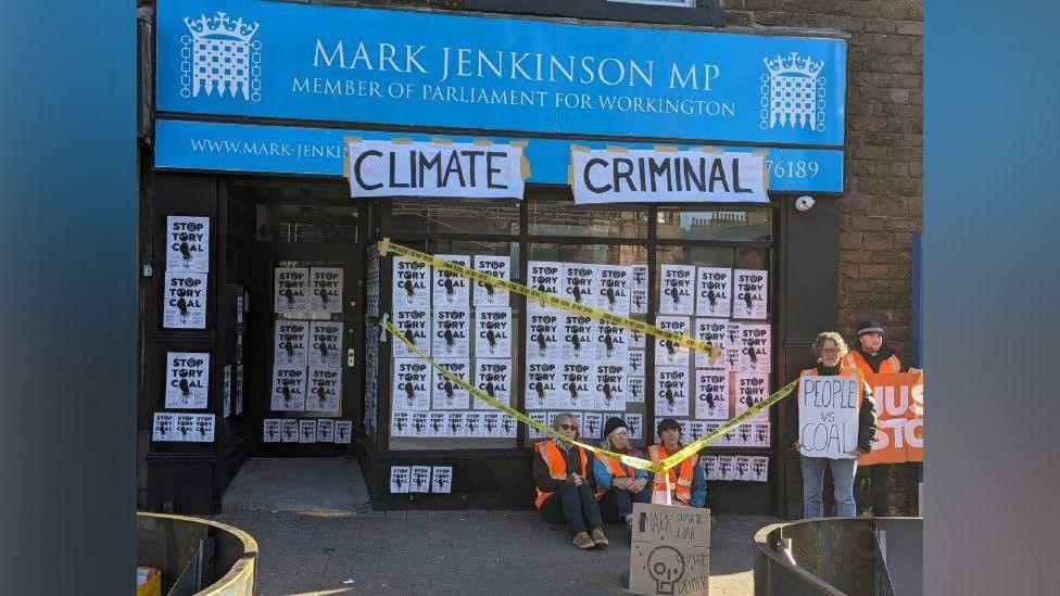 Just Stop Oil protesters sitting outside Mark Jenkinson MP's office 