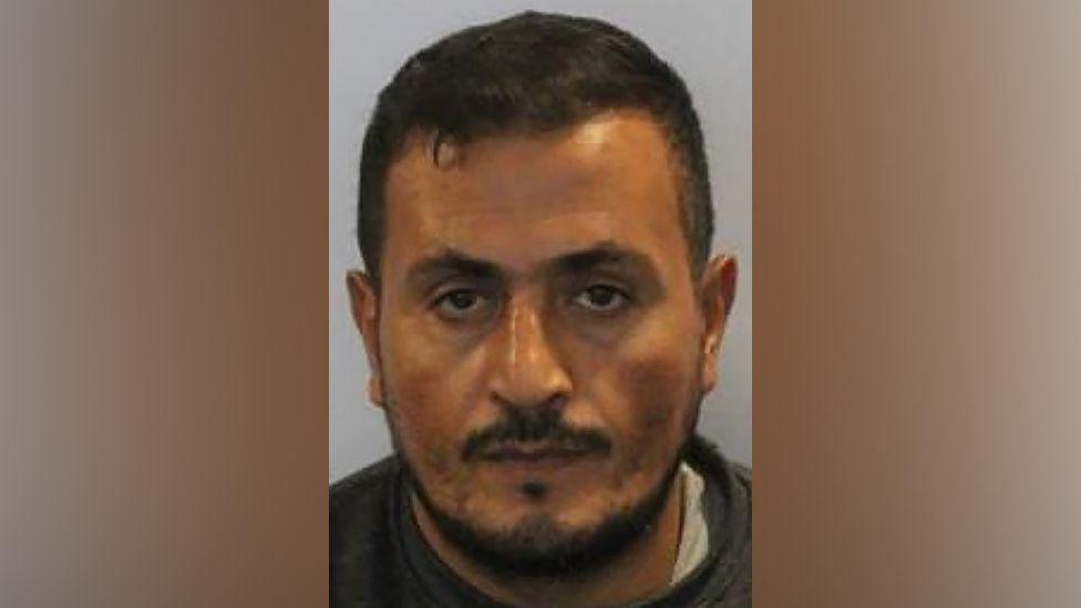 A mugshot of Ebid