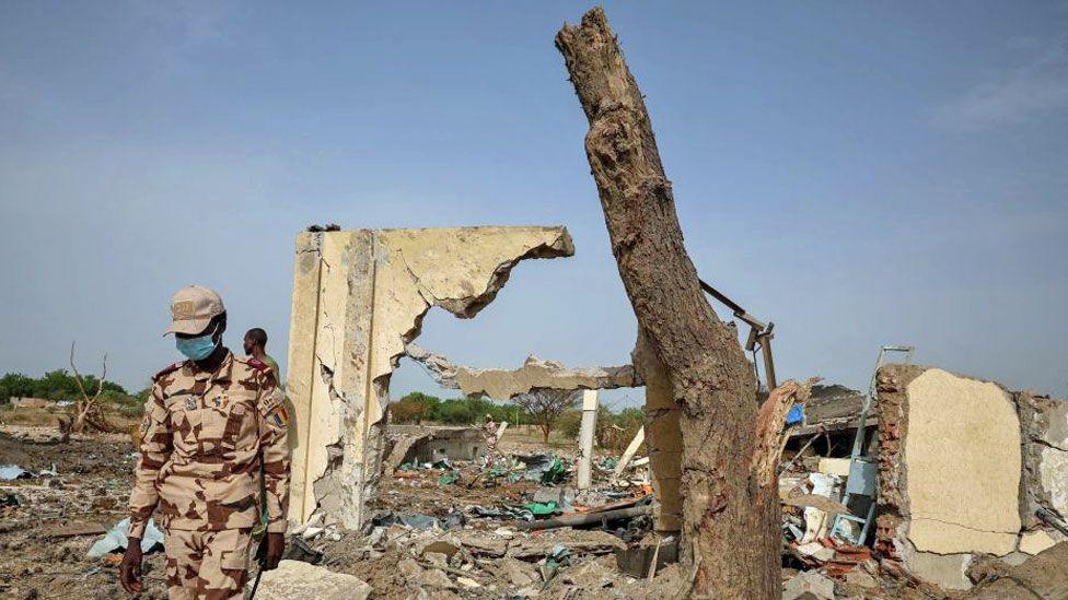 Chadian soldiers walks at the scene of the fire at a ammunition depot in N'Djamena, Chad - 19 June 2024