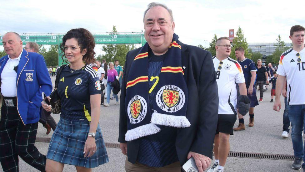 Alex Salmond at the Euros in Germany with a Scotland scarf around his neck