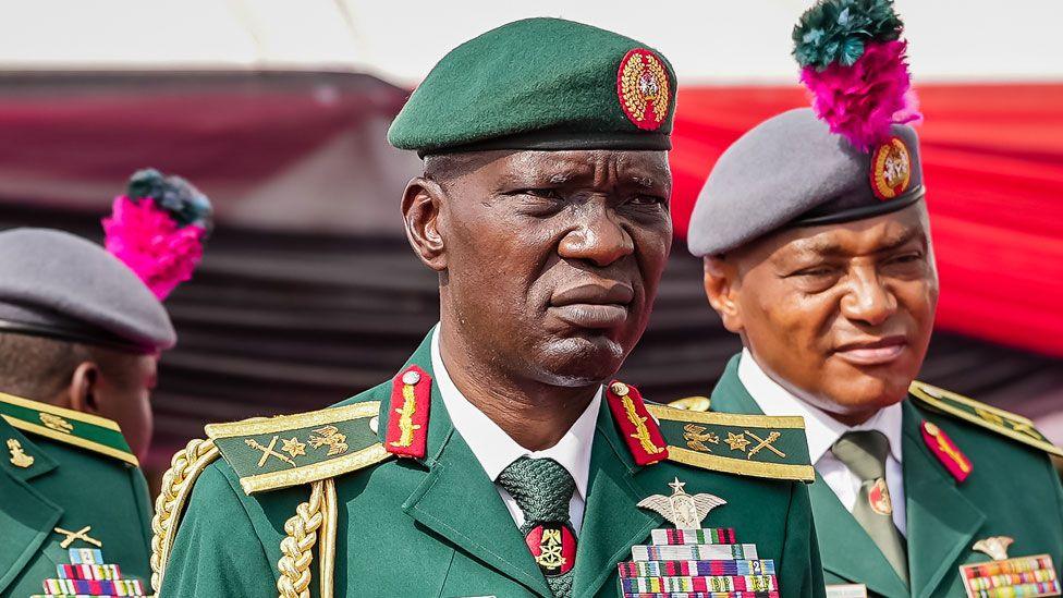 Nigeria's Chief of Army General Taoreed Lagbaja wearing a green military suit with gold army regalia attending a ceremony at the military cemetery in Abuja, Nigeria - March 2024