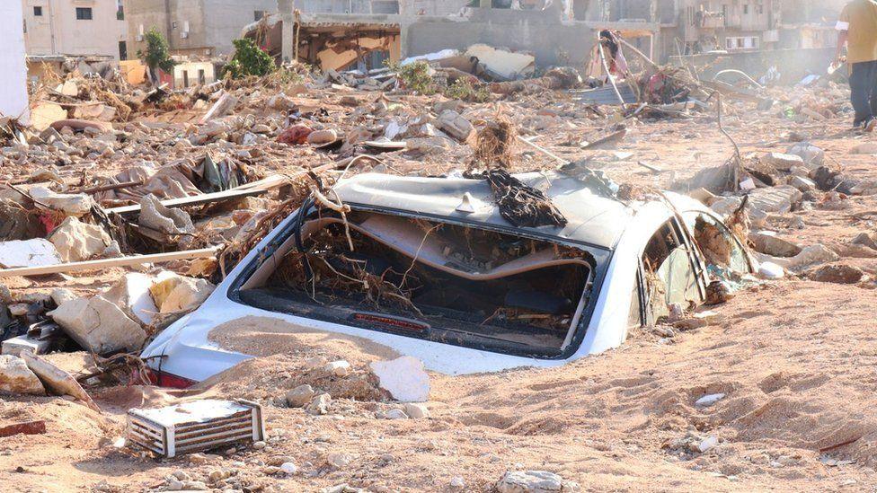 Car engulfed in mud and rubble