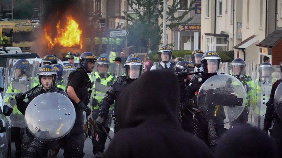 King Charles praises community after riots - BBC Newsround