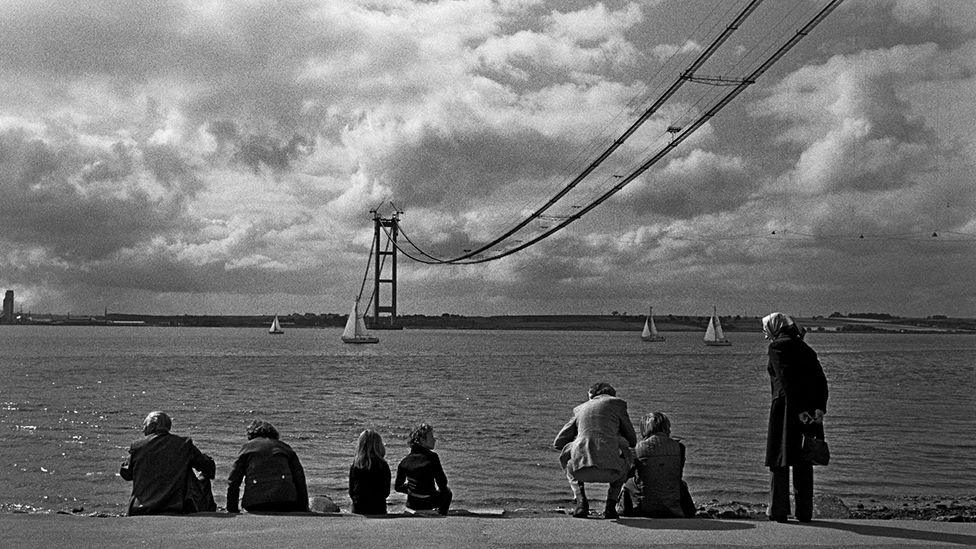 People watching the Humber Bridge being built