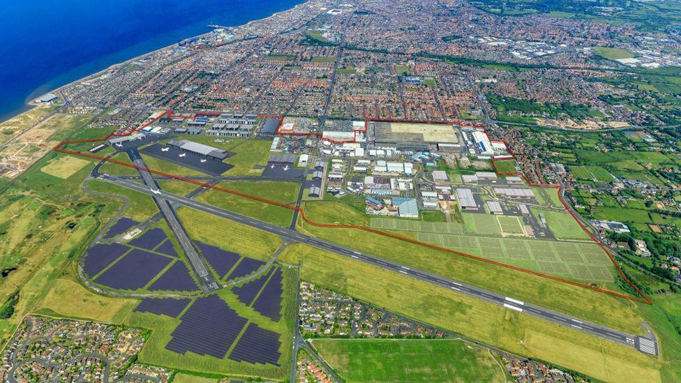 An artist impression of an aerial view of Blackpool Airport showing the proposed solar farm to the south of the runway, which cuts across the centre, with Blackpool and the coast in the distance