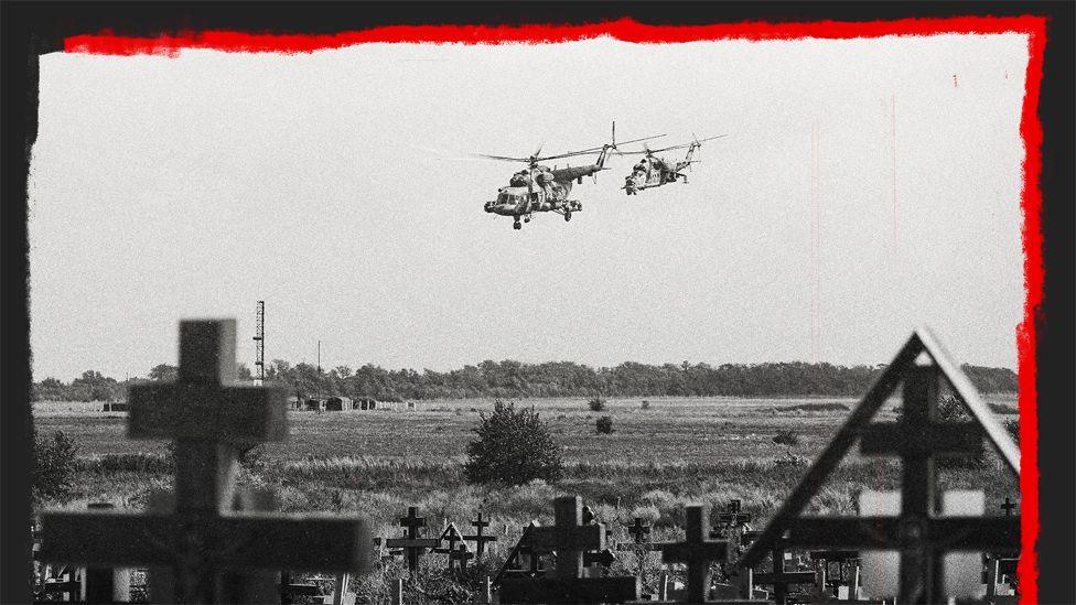 Russian military helicopters flying near a cemetery close to a military airfield outside Taganrog, Rostov in July 2022. 