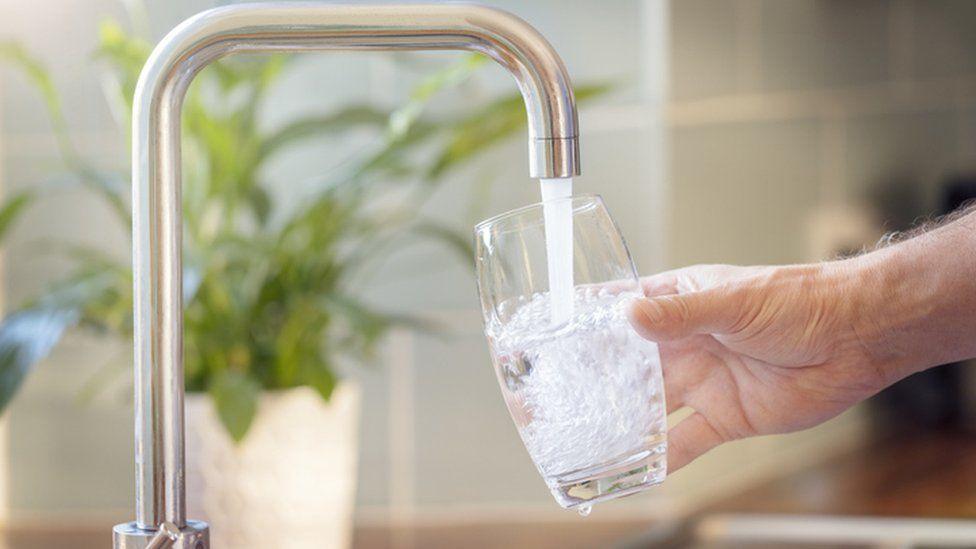 Glass being filled with water 