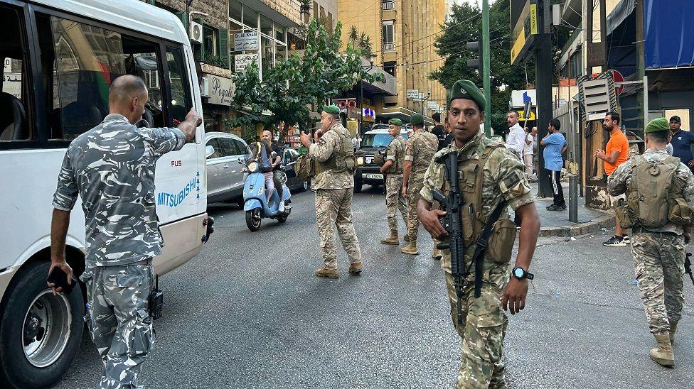 Lebanese army soldiers stand guard in Beirut on September 17, 2024, after explosions hit locations in several Hezbollah strongholds around Lebanon amid ongoing cross-border tensions between Israel and Hezbollah fighters. 