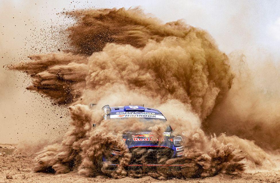 A rally car creates a dramatic shower of dust at Shakedown during the 2025 WRC Safari Rally Kenya