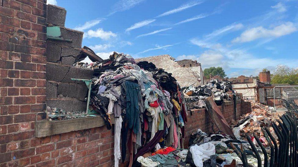 A building and clothes damaged by blaze.