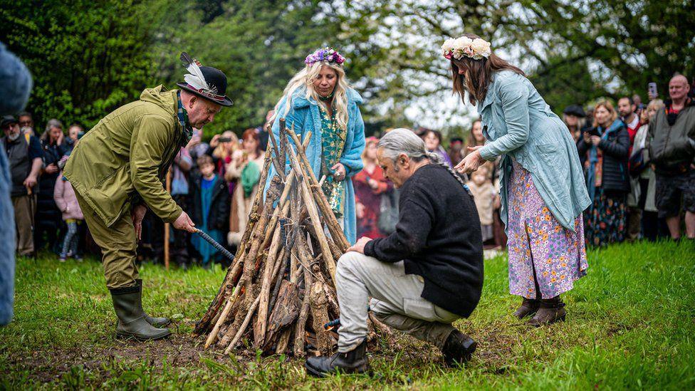 The Beltane bonfire is lit during the ceremony at Chalice Well, Glastonbury, Somerset, 2023.