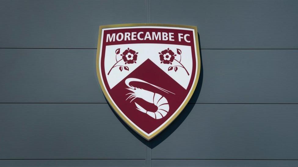 Morecambe's badge on their stadium