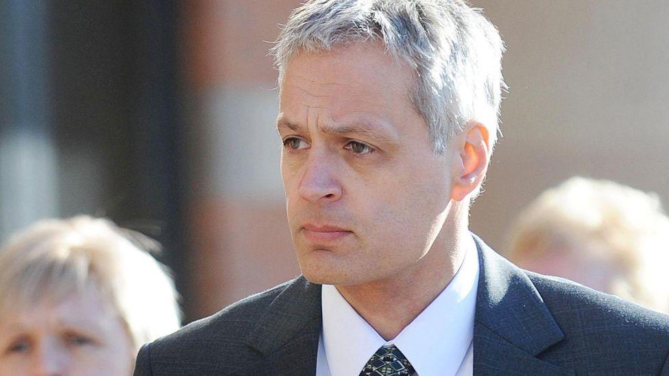 Robin Garbutt wearing a grey suit, arriving at Teeside Crown Court, Middlesbrough for the start of his trial in 2011, where he convicted of murdering his postmistress wife, Diana