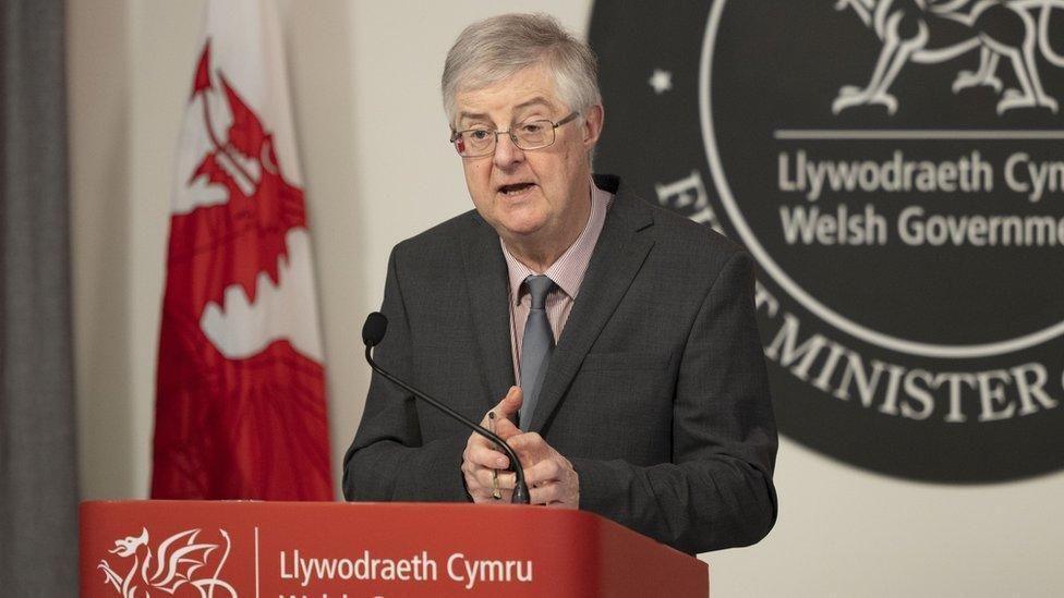 Mark Drakeford at a Welsh government podium 