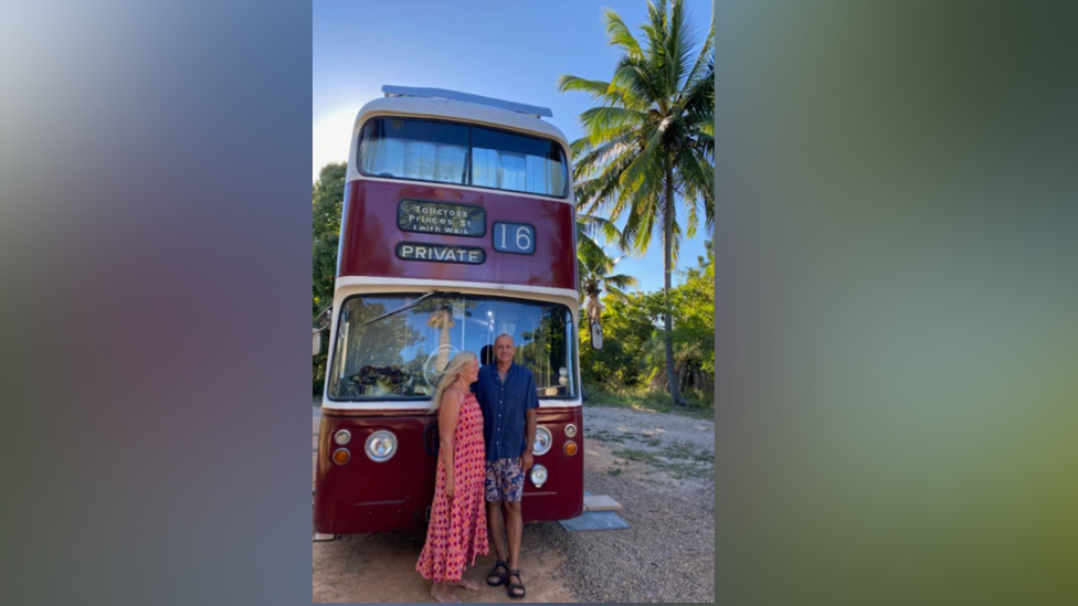 Kim and Ted in front of bus