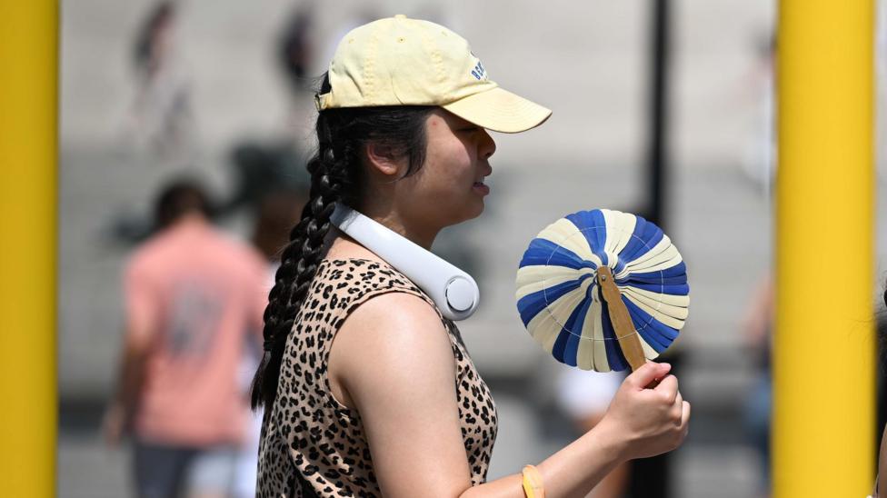UK heatwave spreads further north and west as temperatures continue to climb