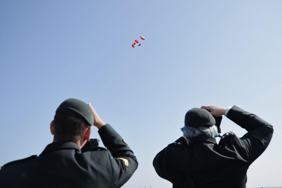 Canadian paratroopers perform during a commemorative ceremony for the 80th anniversary of D-Day landings in Normandy at the Canadian cemetery in Courseulles-sur-Mer, France, 06 June 2024. 