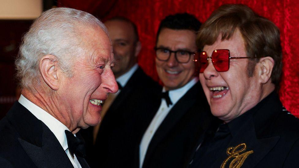 Sir Elton and the King laughing