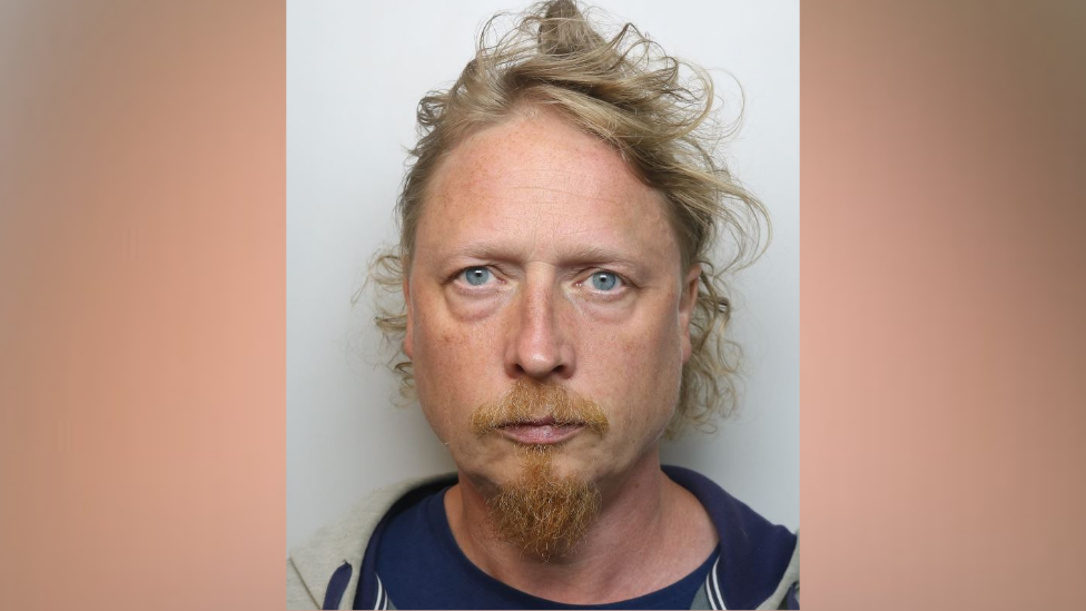 Ole Steinsland custody photo. He has ginger straggly hair and a beard