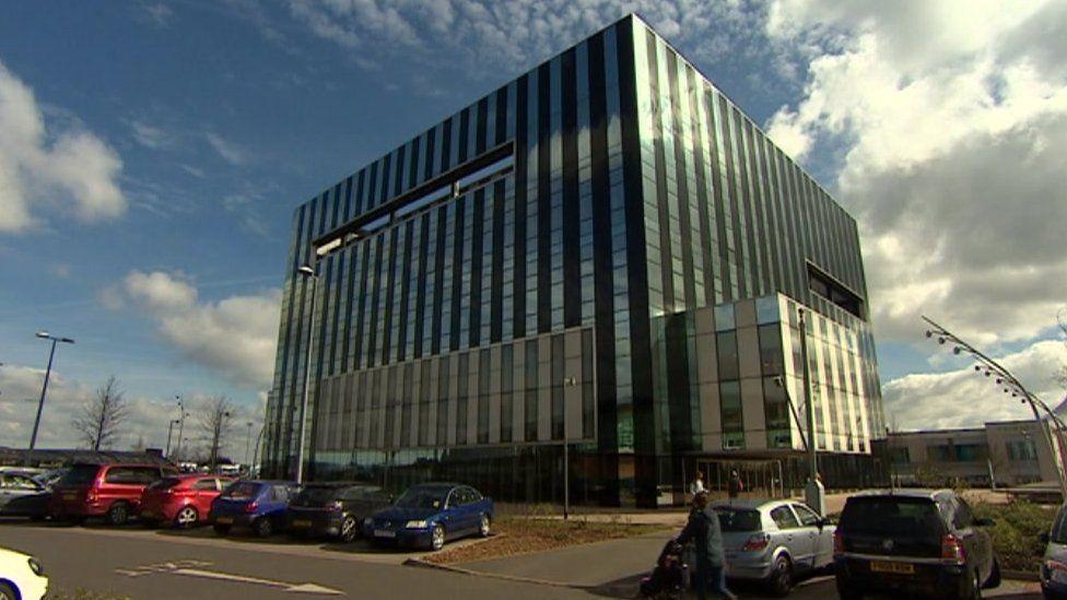 Large multi-storey glass and steel building