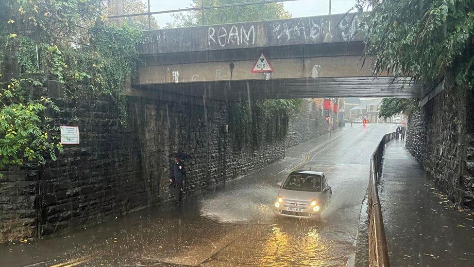 Rain has flooded the road beneath the bridge on Lowther Road, Cathays in Cardiff