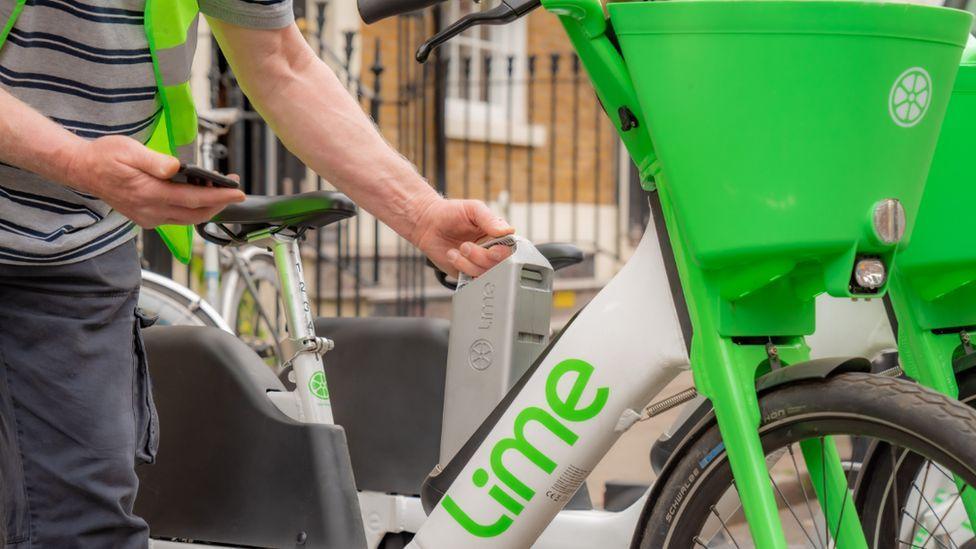 A lime bike being hired