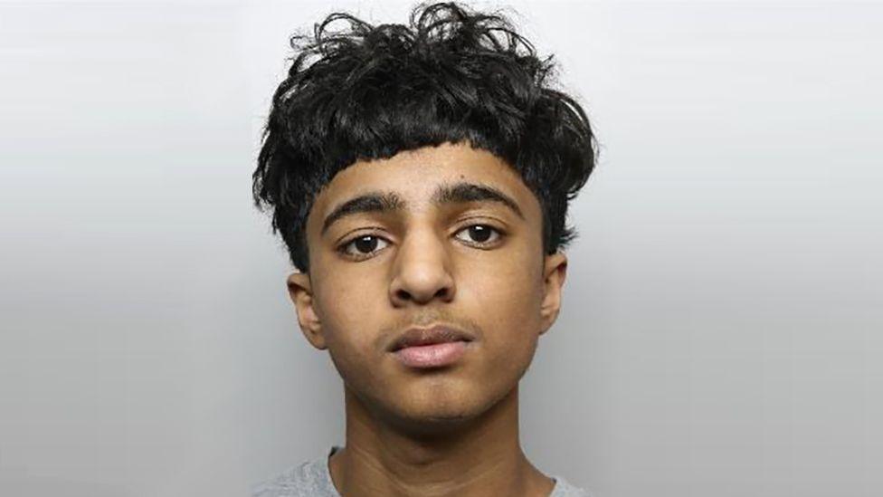 A police image of a 15-year-old boy with black hair.