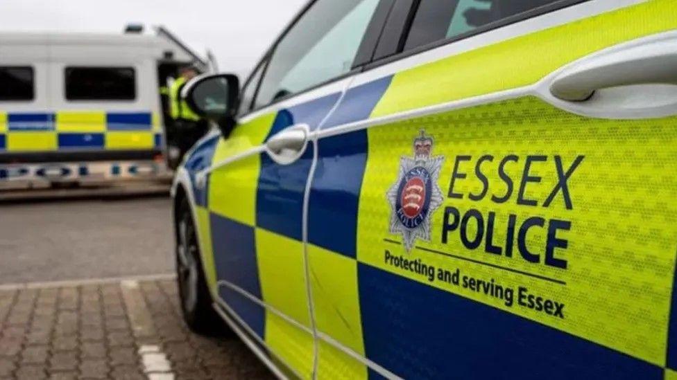 An Essex Police car parked on pavement