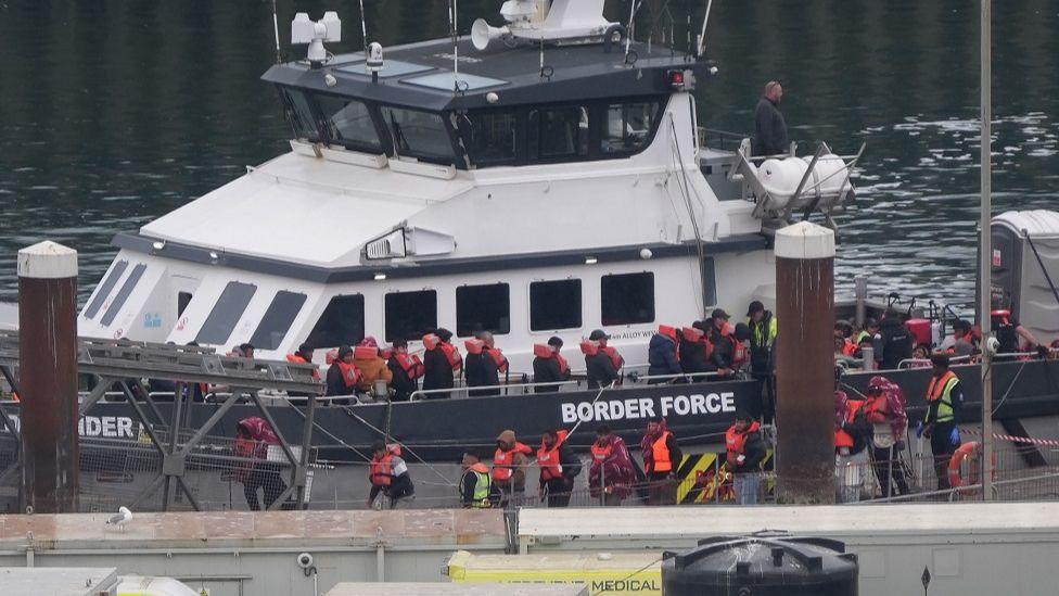 A group of people thought to be migrants are brought in to Dover, Kent, from a Border Force vessel following a small boat incident in the Channel on 21 May 2025