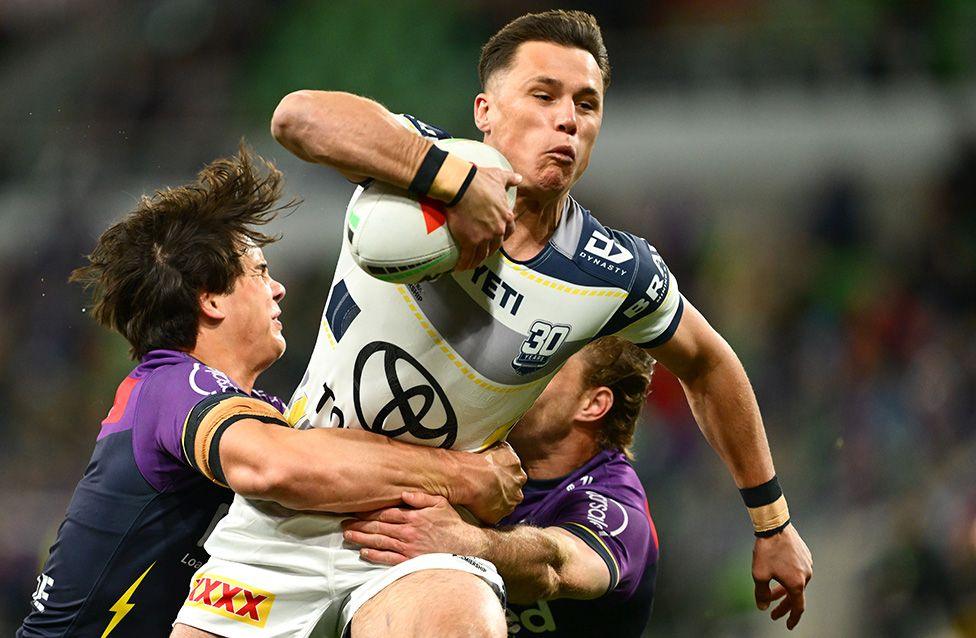 Scott Drinkwater of the Cowboys is tackled during the match at Melbourne Storm in Melbourne. Photo by Quinn Rooney