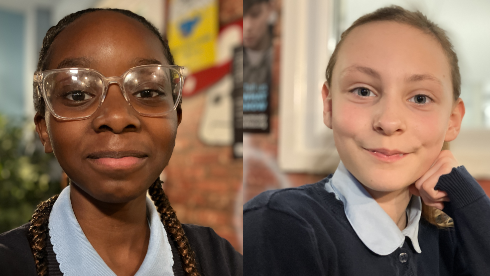 Simi on one side and Willow is on the other. Both are girls in school uniforms looking at the camera.