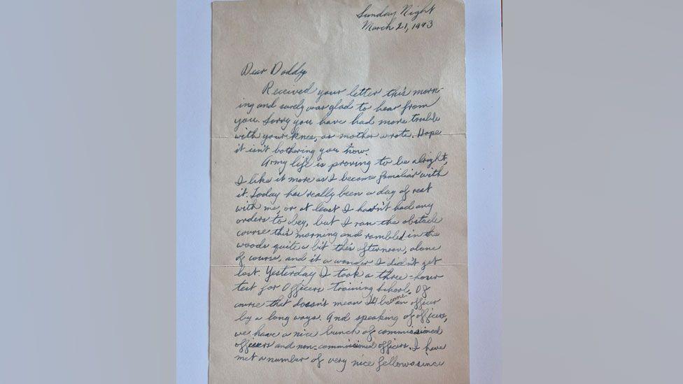 A letter written in a flowing script in blue ink on pale brown paper. It is addressed to Dear Daddy and dated 21 March 1943, written by Earl Thurman to his father, describing his life in the US army.