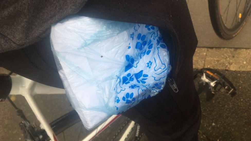 A picture taken from Mr Khalife of his pocket, showing inside it what he says is a dog poo bag containing £1,500 in cash