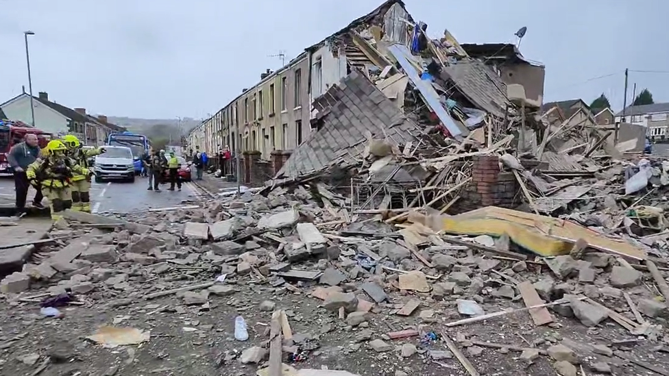 Rubble in the street following house explosion