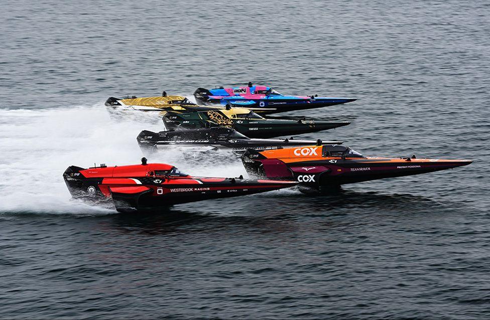 Six all-electric powerboats battle for the lead in the E1 Series race in Jeddah, Saudi Arabia. Photo by Malcolm Griffiths