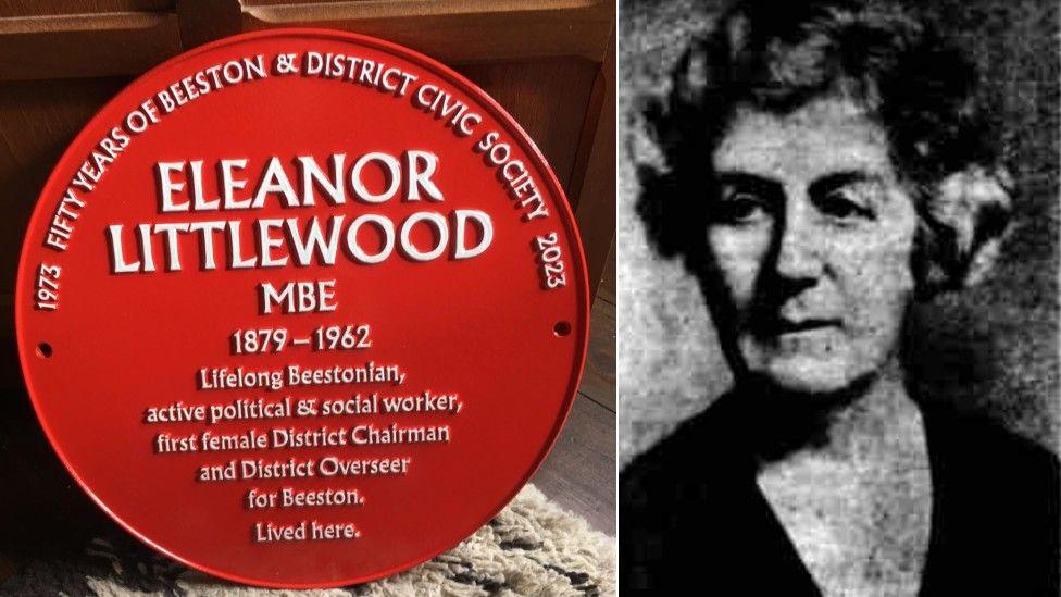 A circular, metal commemorative plaque, red with white writing, bearing the name of Eleanor Littlewood 'Lifelong Beestonian'