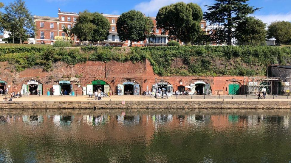 Exeter Quay, by the River Exe, and shops built into arches open